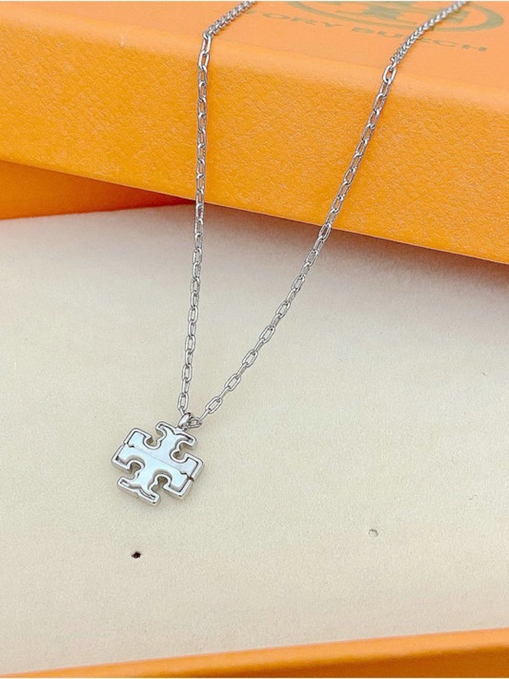 Tory Burch Silver White Enamel Puzzle Cross Pendant Necklace